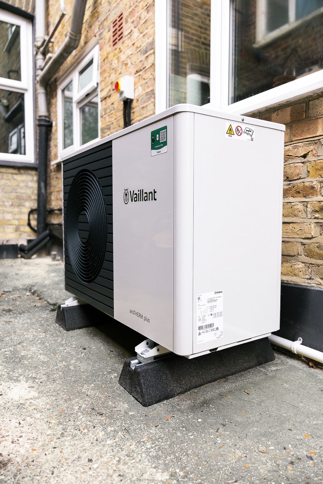 A Vaillant air source heat pump installed in a side passage of a property in London