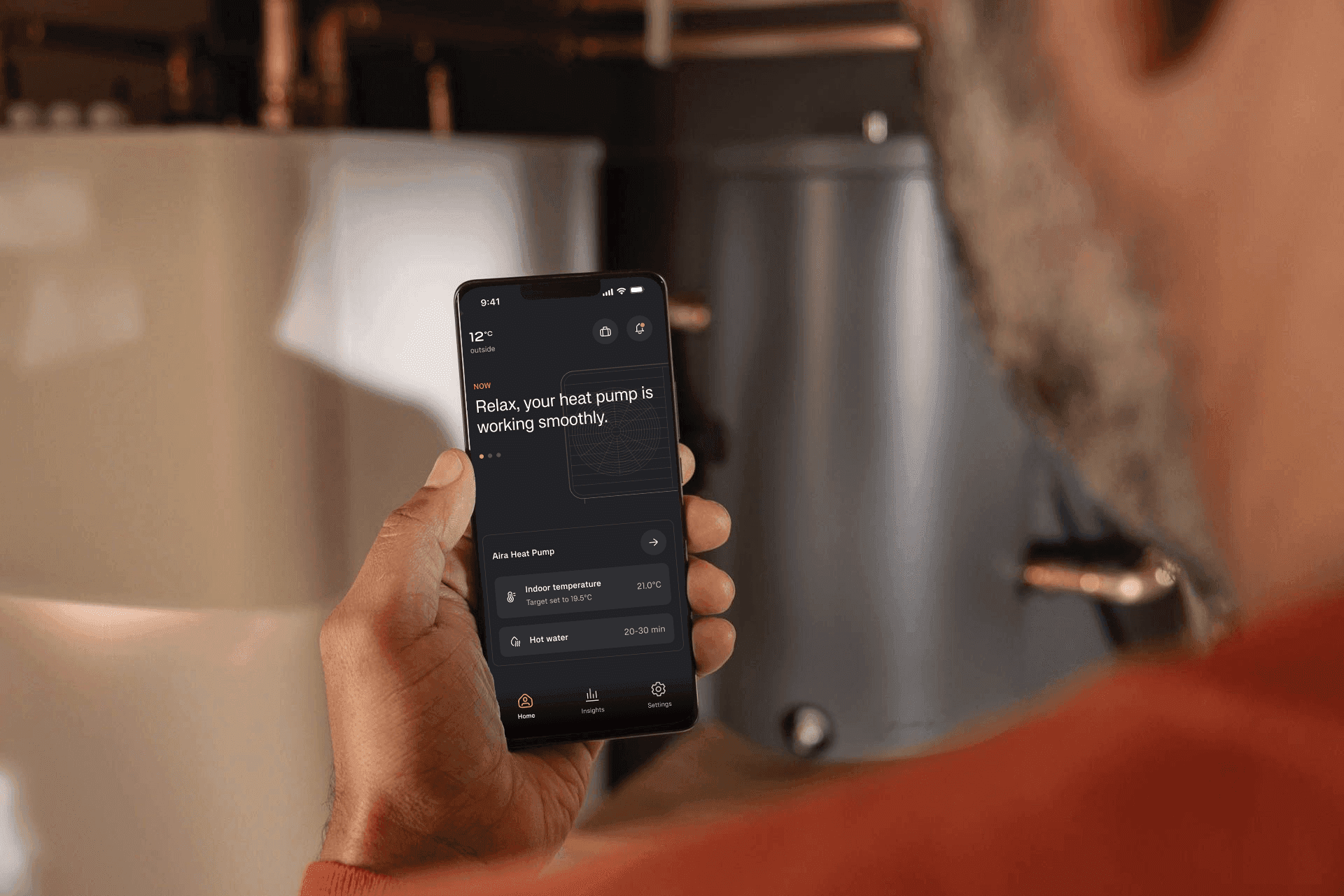 A person holding a phone with the Aira app