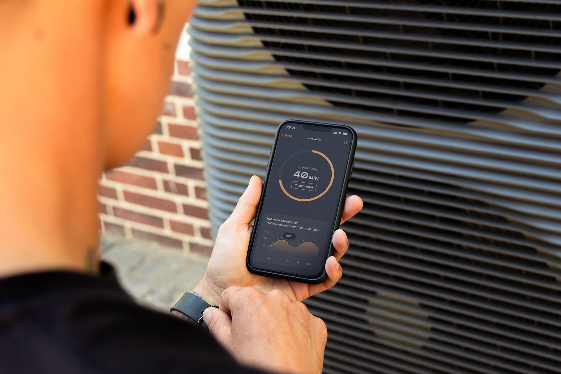 Man using Aira Home Energy app for his Aira Heat Pump